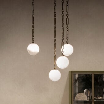 Distinguished Rugiano Collier suspension lamp with spherical white-glass diffusers and warm bronzed brass finish crafted in Italy