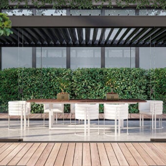 Elegant Rugiano Mirage table crafted with warm Mogano Tinto wood and a durable Outdoor Bronze Steel base with white legs