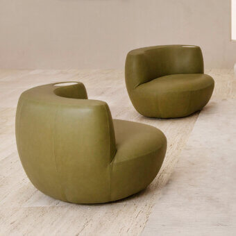 Superior Rugiano Rafael lounge chair with captivating fluid silhouette upholstered in smooth olive green leather and integrated marble detail