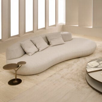 Superior Rugiano Rafael sofa with beautifully curved form upholstered in matte beige fabric and built-in marble detail