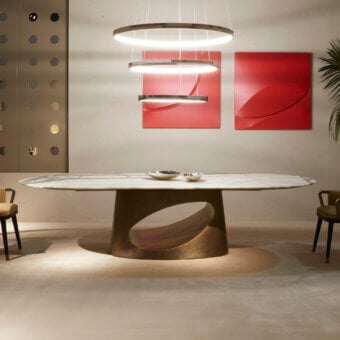 Exclusive Rugiano Ring table with elegantly curved white marble and sculpted brownish-gold toned bronze base crafted with a polished finish
