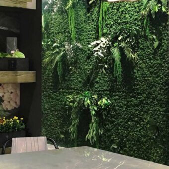 Distinguished Adriani e Rossi Lichen wall with layered leaves—fern, ivy, eucalyptus—crafted in Italy with a remarkably organic aesthetic