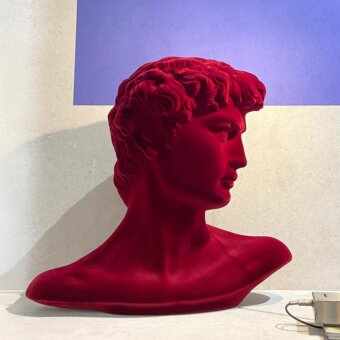 Elegant Adriani e Rossi Little David sculpture crafted in plaster with deep red velvet finish and matte texture