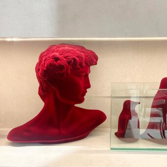 Exceptional Adriani e Rossi Little David sculpture crafted in plaster with a saturated red velvet finish