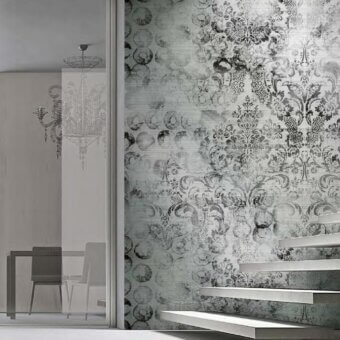 Distinguished Adriani e Rossi Victory wallpaper showcases baroque-inspired swirling floral, geometric patterns with a subtly distressed gray surface