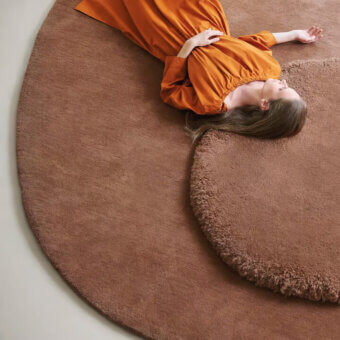 Exceptional Amini Ciclopi-Roccia rug crafted in earthy brown pure organic wool with hand-washed carved finish