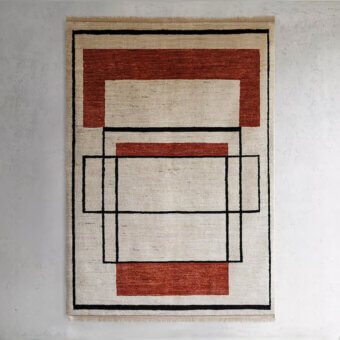 Exceptional Amini Collective rug crafted from Afghanistan wool with minimalist geometric design and hand-washed carved texture
