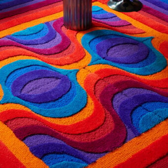 Distinguished Amini Domino rug crafted from New Zealand wool with swirling patterns and hand-washed carved finish
