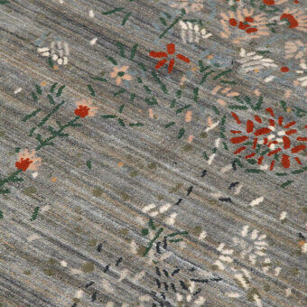 Exceptional Amini Giardino rug with subtly distressed floral patterns in grey, red, and green wool viscose pile with a hand-washed finish