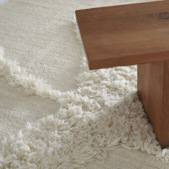 Distinguished Amini Il Volo rug with flowing organic design crafted in ivory jute and New Zealand wool with a soft hand-washed finish