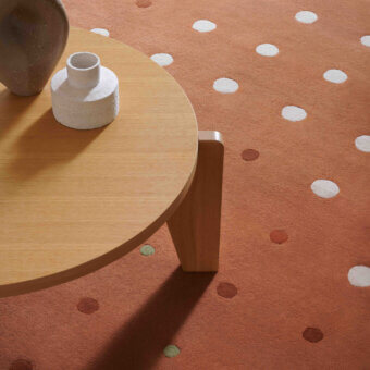 Exceptional Amini JC-1 Bubbles rug with circular motifs crafted in warm rust and cream New Zealand wool with a cut-pile finish