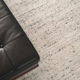 Sophisticated Amini Perla rug crafted from bamboo silk and wool with striated pattern and hand-washed texture