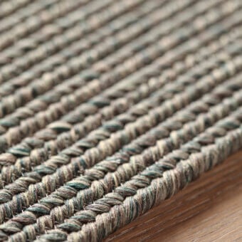 Exceptional Amini Plain rug crafted with polypropylene, viscose, polyester in muted gray and beige tones with hand clipping