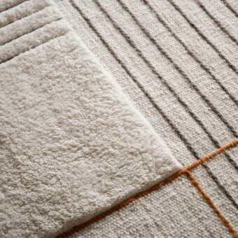Distinguished Amini RD Halong rug crafted in off-white and cream semi-worsted wool with subtle gray and muted orange-brown tones and hand-washed finish