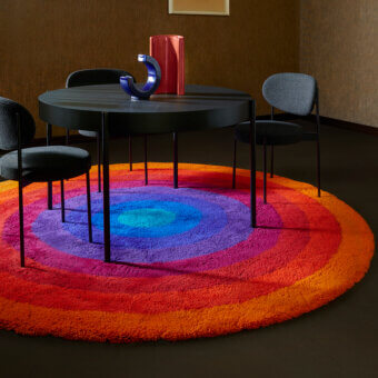 Exceptional Amini Romantica-Circle rug with a vibrant color gradient and hand-tufted New Zealand wool pile height