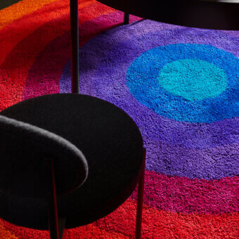 Exclusive Amini Romantica-Circle rug hand-tufted in New Zealand wool with carved, clipped finish and vibrant chromatic bands