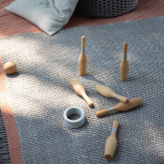 Refined Amini Sesame rug crafted from recycled PET with muted gray tones and hand-clipped fringe detailing