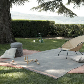 Distinguished Amini Sesame rug crafted in shifting taupe and coral hues from 100% recycled PET with hand-clipped finishing