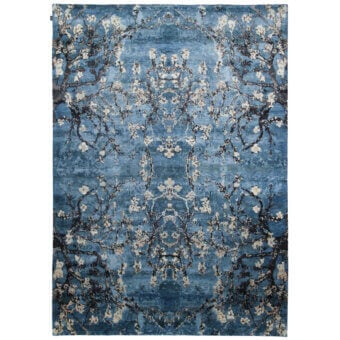 Distinguished Amini Vincent rug crafted from pure silk with a muted blue field and off-white floral pattern, finished with hand washing