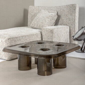 Innovative Driade Coupelle coffee table in brownish-grey translucent material with a glossy finish and cylindrical legs