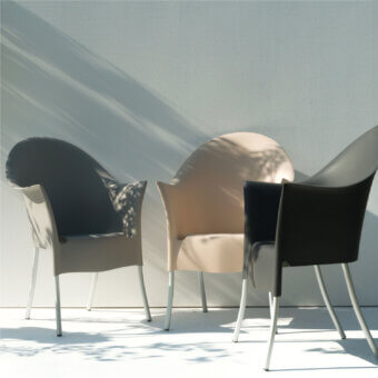 Elegant Driade Lord Yo armchair with organic curved form and warm beige molded polypropylene shell built with refined aluminum