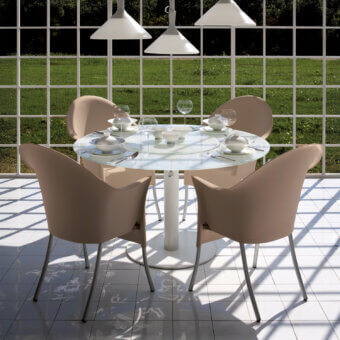 Distinguished Driade Lord Yo armchair with refined aluminum structure and molded polypropylene shell in dusty rose with matte finish