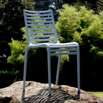 Exceptional Driade Pip-e chair crafted in muted grey-white polypropylene with horizontal slats and a curved backrest