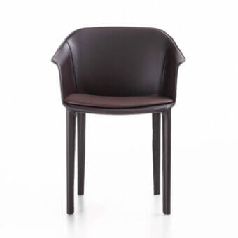 Captivating Enrico Pellizzoni Eva armchair with curved form and integrated seat, upholstered in brownish-purple leather with tonal variations