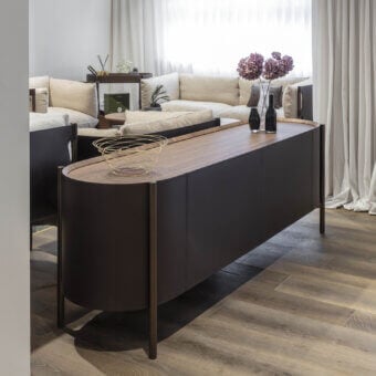 Distinguished Enrico Pellizzoni Iris sideboard crafted with Canaletto walnut and premium leather upholstery in chromatic contrast with a dark metal base