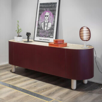 Distinguished Enrico Pellizzoni Isabel sideboard crafted with Canaletto walnut and plum leather, featuring curved form with integrated lighting