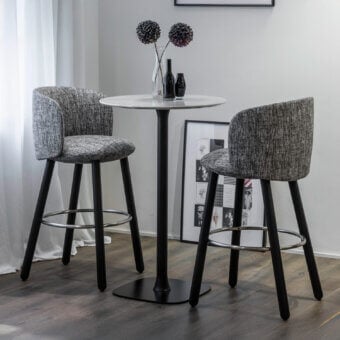 Elegant Enrico Pellizzoni Isabel stool with mottled gray textile and dark matte Canaletto walnut turned legs