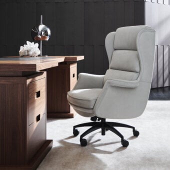 Distinguished Mascheroni One Office armchair upholstered in pale gray textile with a glossy dark base and castors