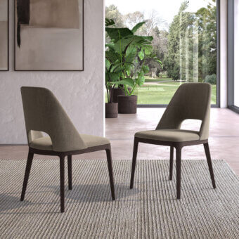 Hole chairs by Ozzio Italia, taupe boucle upholstery, dark wood frames with angled legs and open-slatted backrests, modern interior setting.