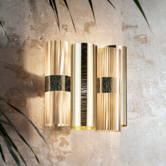 Distinguished Slamp La Lollo wall lamp with horizontally aligned fixtures crafted in Lentiflex® and Opalflex® technopolymers with warm gold and charcoal finish