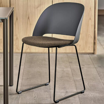 Elegant Bontempi Polo chair with dark gray shell and mottled brown beige seat cushion built with a black metal sled base