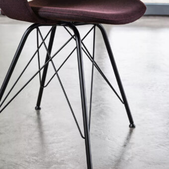 Distinguished Bontempi Polo chair with deep plum textile upholstery and matte black powder-coated spider base