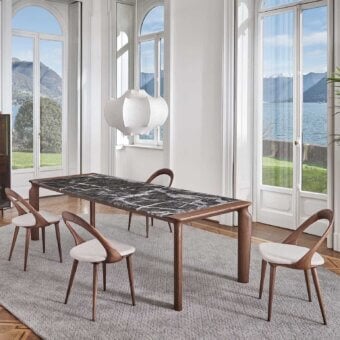 Distinguished Porada Amphora table with a striking marble tabletop and solid Canaletta walnut legs in a satin finish