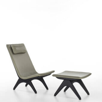 Elegant Porada Koko lounge chair with Canaletta walnut frame and light grey polyurethane shell with black chrome details
