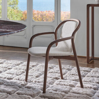 Elegant Porada Petra chair with solid Canaletta walnut frame and subtly textured light beige upholstery