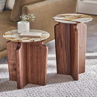 Elegant Porada Podi side table with curved canaletta walnut base and refined round marble tabletop in a medium-toned brown hue with satin finish