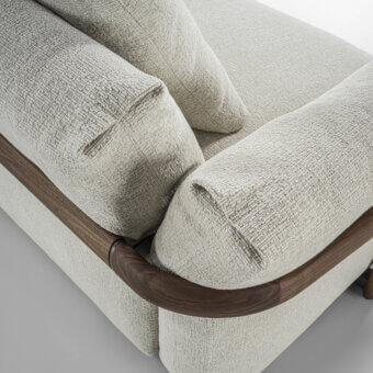 Exceptional Porada Ronny sofa with sculpted form and inviting neutral beige textile upholstery in a satin medium-brown finish