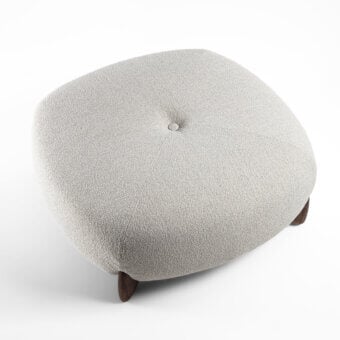 Distinguished Porada Softbay ottoman upholstered in textured light beige textile with dark satin-finish metal legs and refined criss-cross stitching