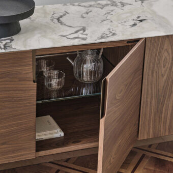 Distinguished Porada Tylsa sideboard built in solid Canaletta walnut with satin finish and a marble top featuring gray and white veining