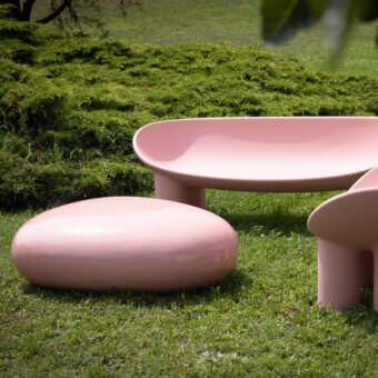 Superior Driade Koishi ottoman crafted from painted fiberglass in a muted pink with a glossy finish
