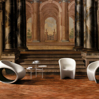 Exceptional Driade MT1 lounge chair molded in polyethylene with a matte finish, showcasing sand white exterior and vibrant red interior