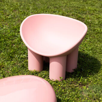 Distinguished Driade Roly Poly lounge chair with a bowl-shaped seat and cylindrical legs in muted pink polyethylene with a smooth matte finish