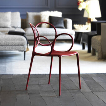 Superior Driade Sissi chair molded from durable glass fiber reinforced copolymer with glossy red finish and natural polyethylene feet
