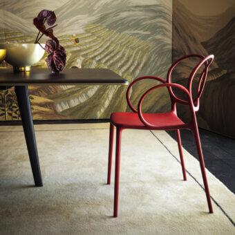 Distinguished Driade Sissi chair molded from glass fiber reinforced copolymer with glossy red finish and natural polyethylene feet