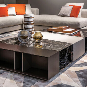 Distinguished Giorgetti Scaleno coffee table crafted in Italy with cool black marble, warm ash wood, and supple leather