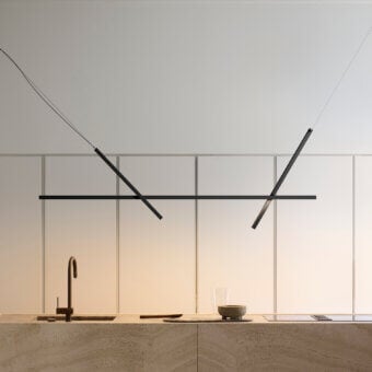 Innovative Luceplan Across suspension lamp with black aluminum and a sleek polycarbonate diffuser for contemporary illumination